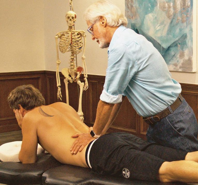 Image 3. Sphinx Hyperextension Test: The client assumes a pain-free sphinx position and the therapist's soft palms apply very gentle pressure to each side of the lumbar spine. Record as positive for possible Z-joint pathology if the client reports localized low-back or gluteal pain.